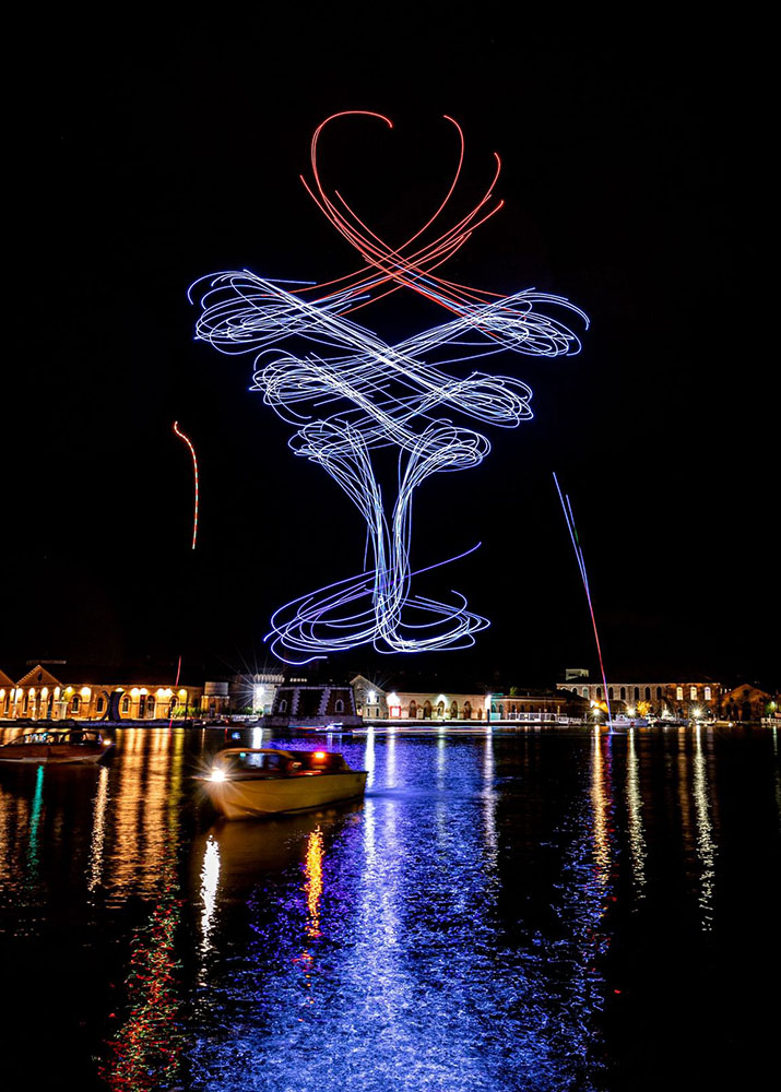 Romantic drone show forming heart shape at wedding